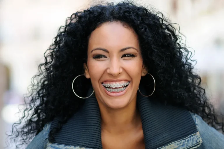 Smiling teen wearing traditional braces