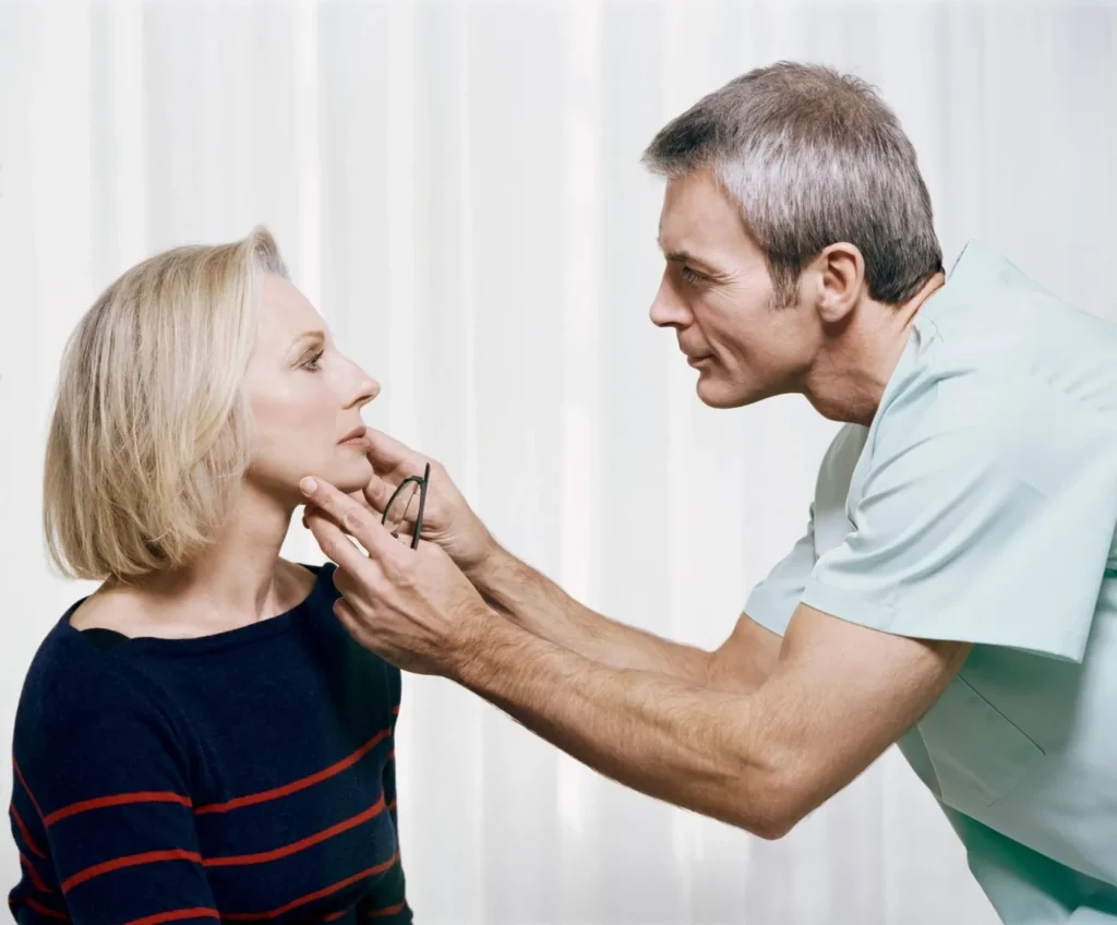 Dentist reviewing a jaw X-ray before orthognathic surgery